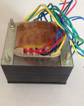 A 175W tube amplifier power transformer with multiple colored wires emerging from it, placed on a white surface.